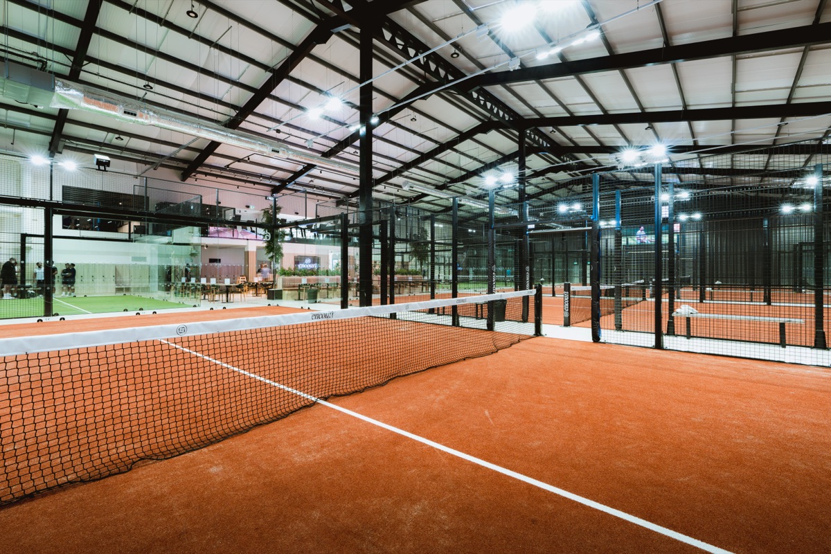 An indoor padel court at Encourt