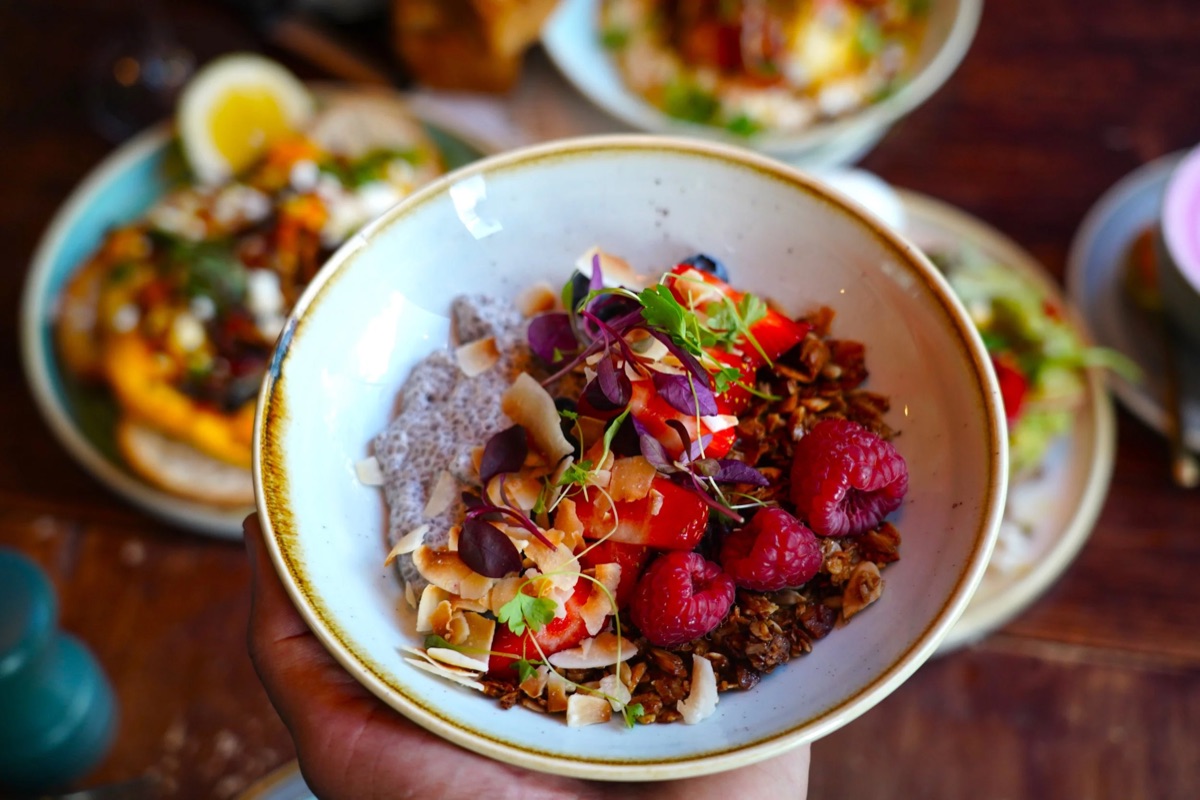A granola and berry brunch bowl at Bobo & Wild